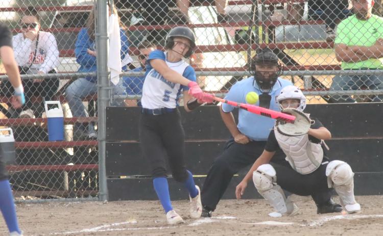 The Blue River Panthers softball team capped a strong week with an 11-1 win at Centennial on Thursday night. Here senior Danica Watts homers to right field as she was 4 for 4 in the win. over the Broncos. PCN photo by Ken Kush.