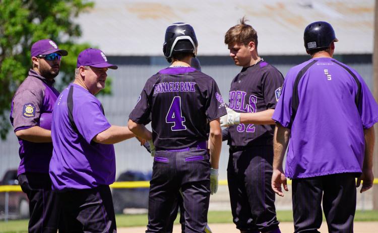 SOS Rebels meet to strategize the game. PCN file photo.